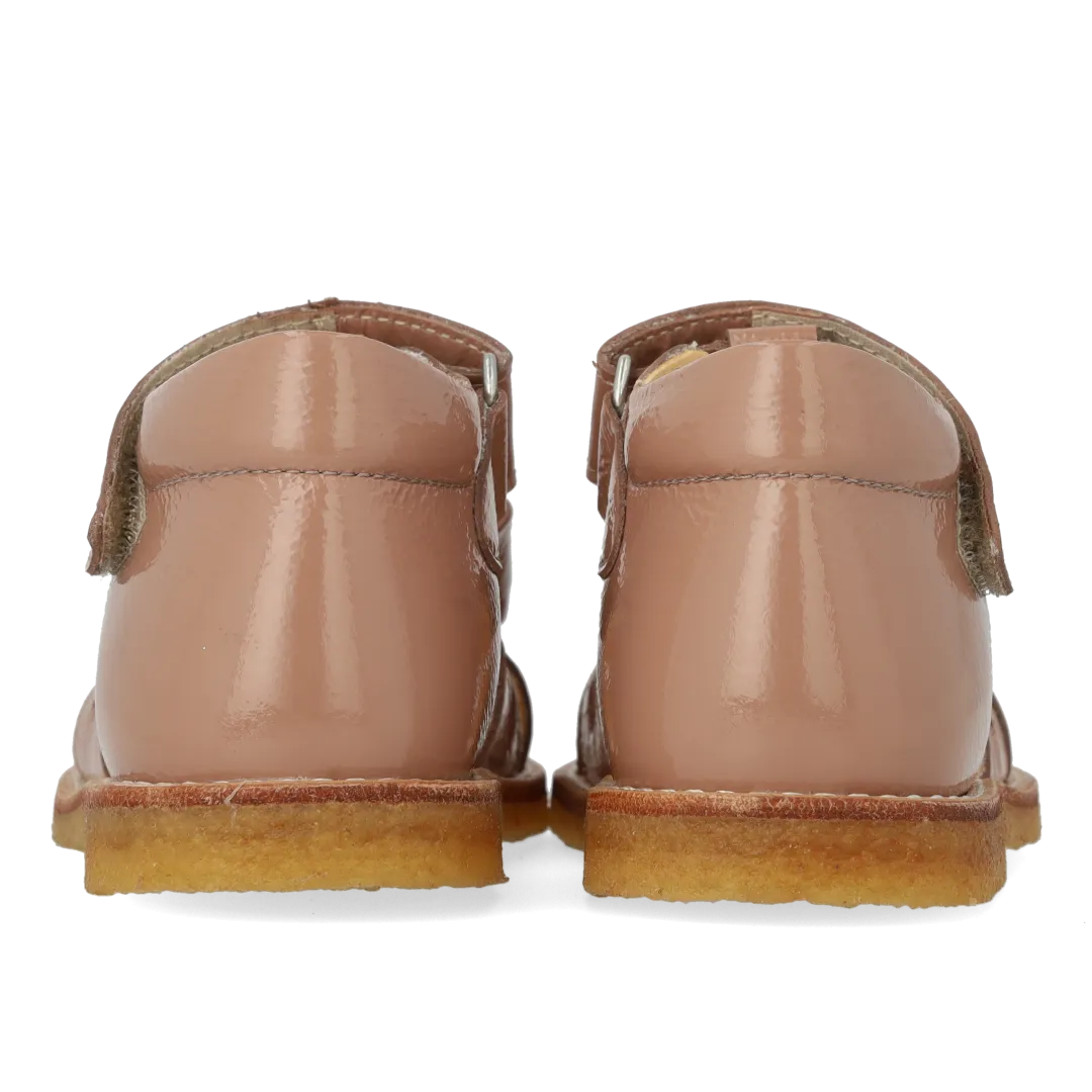 Starter sandal with a bow and velcro closure